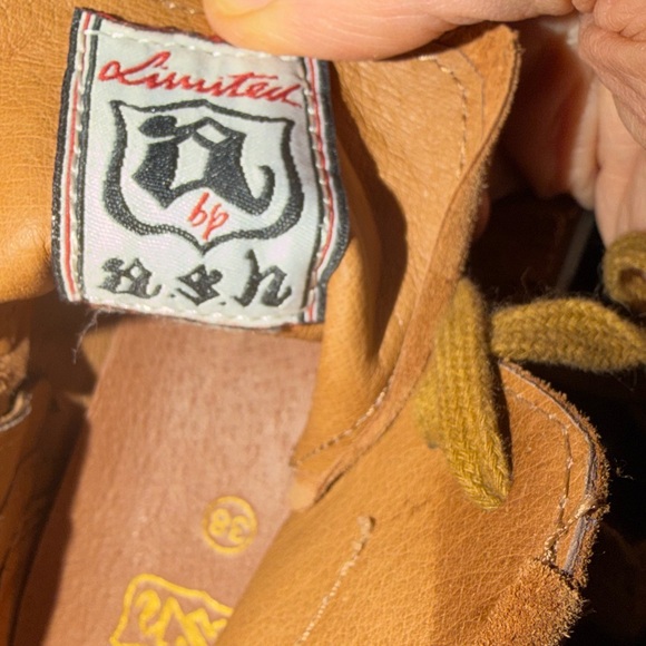 The sneakers are the ASH Marlow Fringe Lace Up High Top Sneakers. Size 38 - Picture 14 of 16